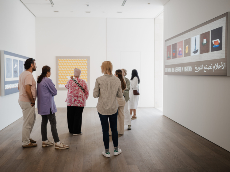 A multi-national group visiting an exhibition at Mudam Luxembourg.