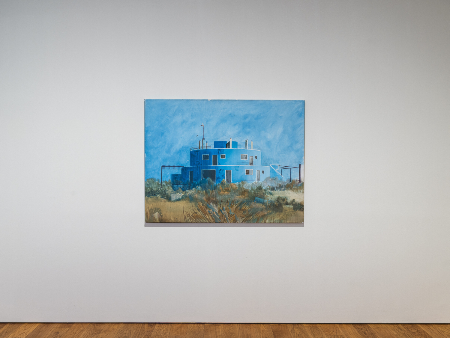 Exhibition view ‘Seven Paintings – Seven Encounters’, Mudam Luxembourg. Photo: Mike Zenari © Mudam Luxembourg. Edi Hila, ‘The Blue House’, 2000. Collection Mudam Luxembourg. Acquisition 2019